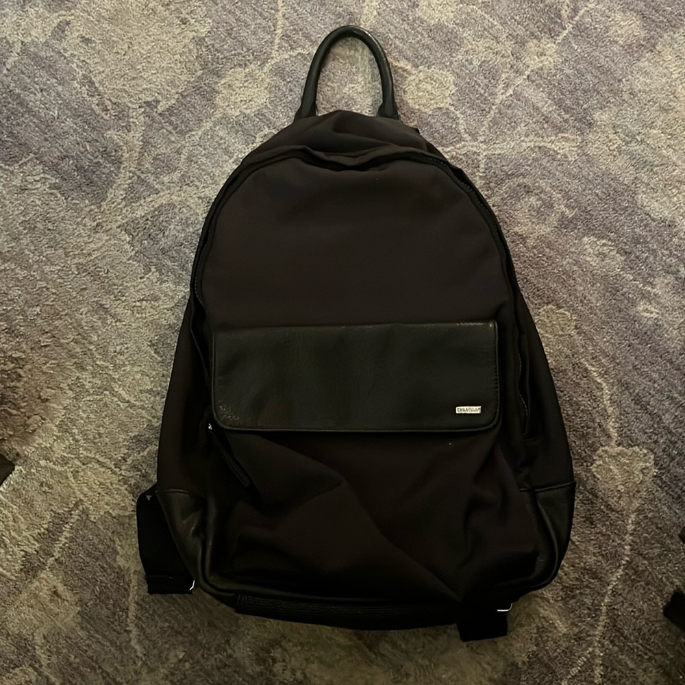 Black Calvin Klein backpack with leather and front pocket